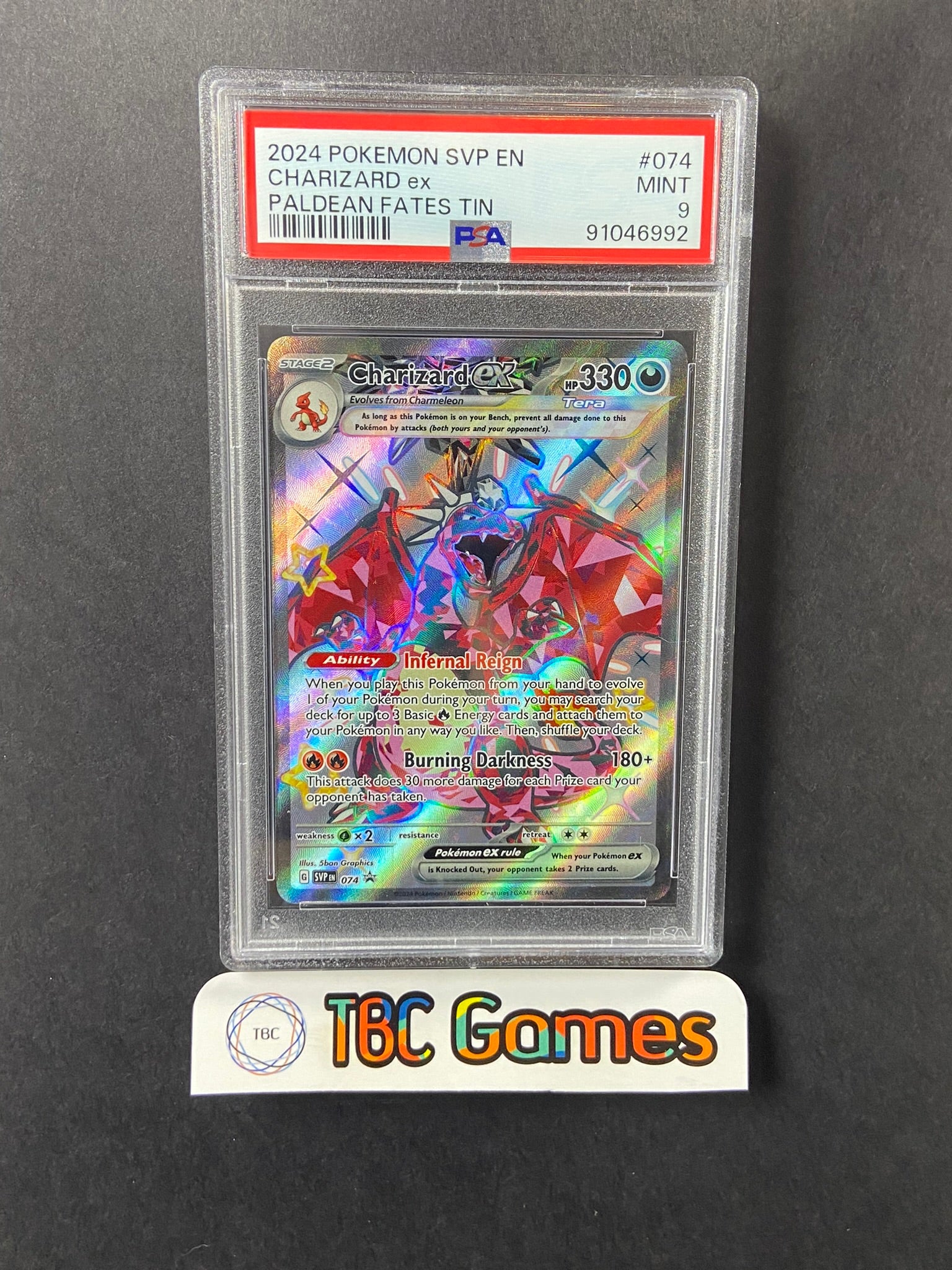 Charizard ex SVP 074 Paldean Fates Tin PSA 9 TBC Games Charizard ex SVP 074 Paldean Fates Tin PSA 9 TBC Games