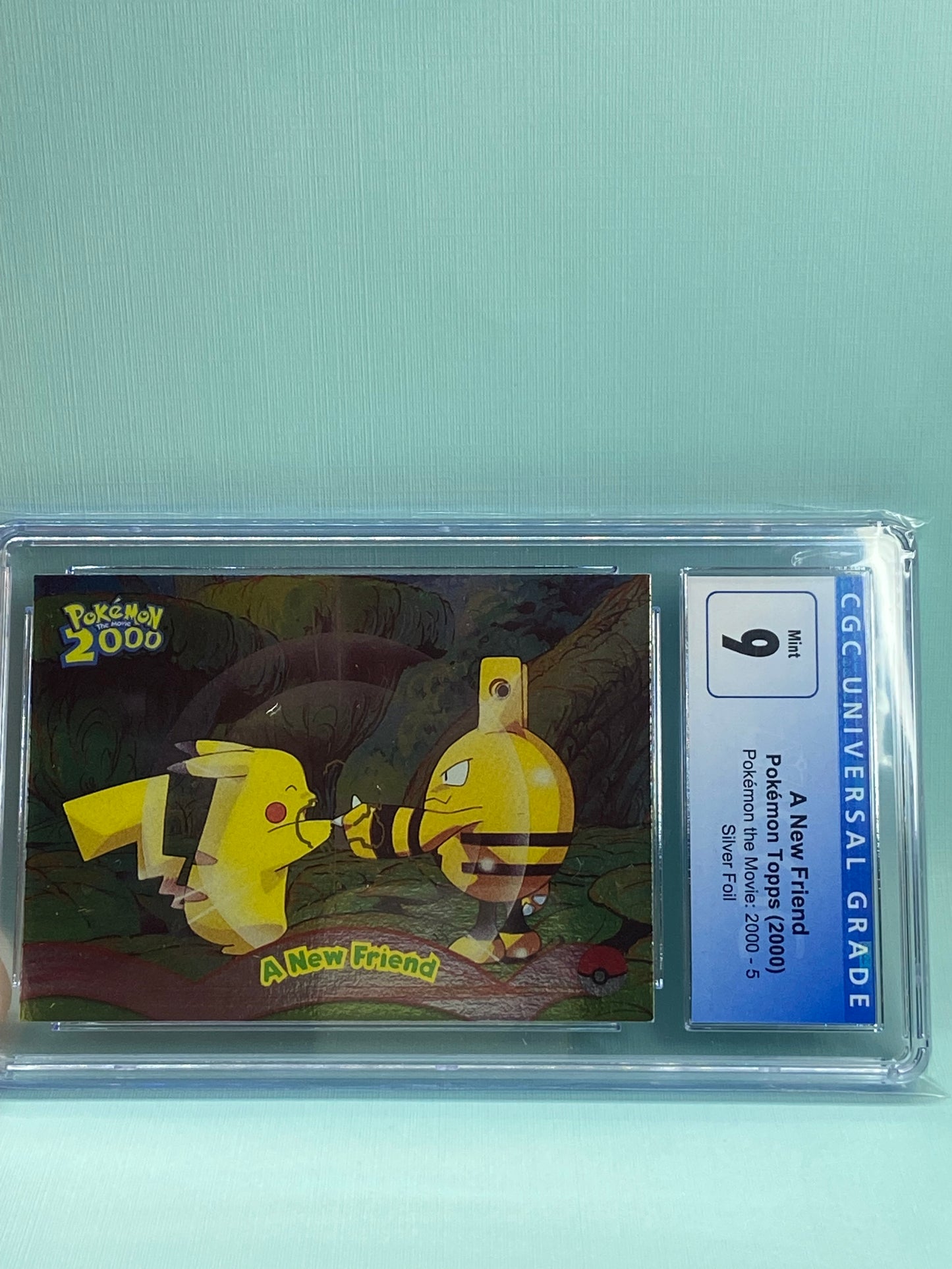 A New Friend Topps Pokemon the Movie 2000 Pikachu Elekid Foil CGC 9